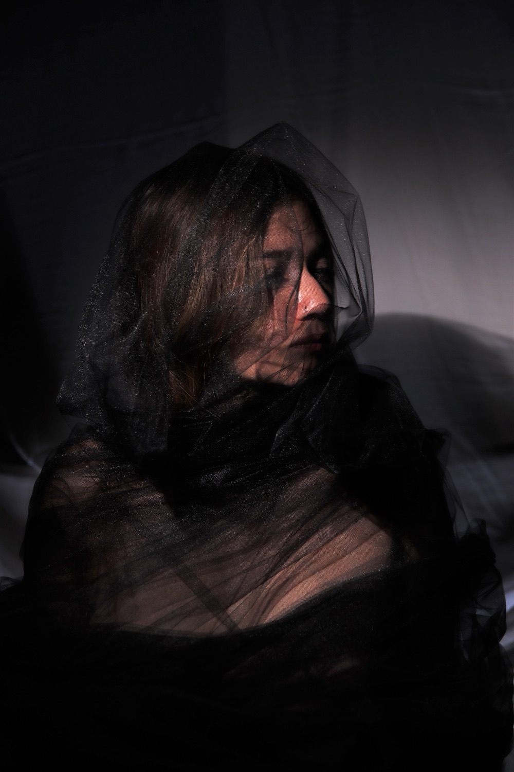 El Negro — rostro tras gasa negra